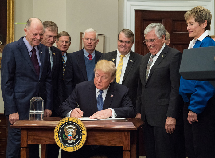 President Donald Trump signs the Space Policy Directive - 1, directing NASA to return to the moon